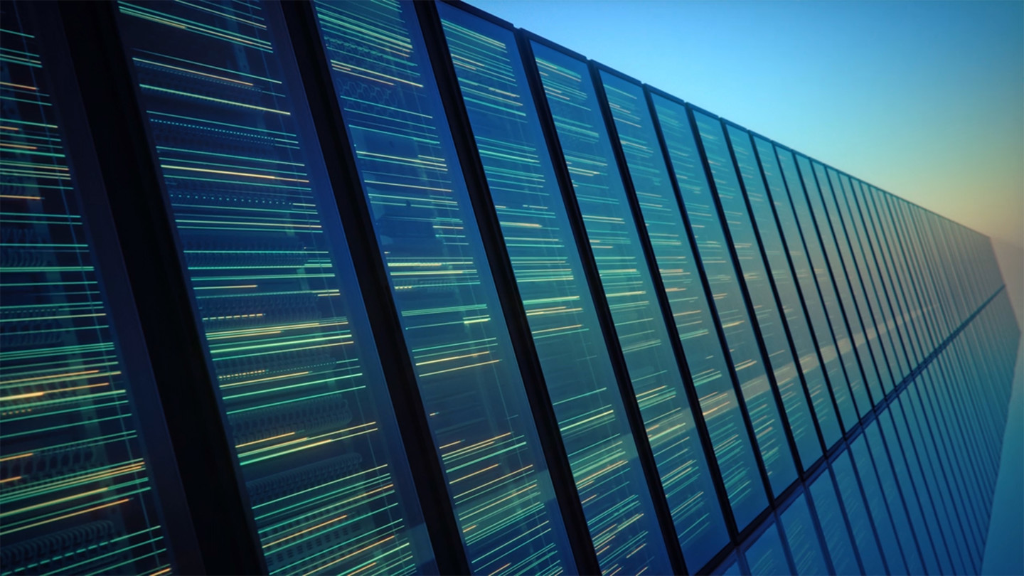 Image of data centre with lights on monitors